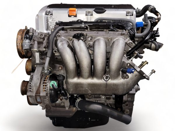 Used Honda Civic engine with visible intake manifold and pulleys on a white background