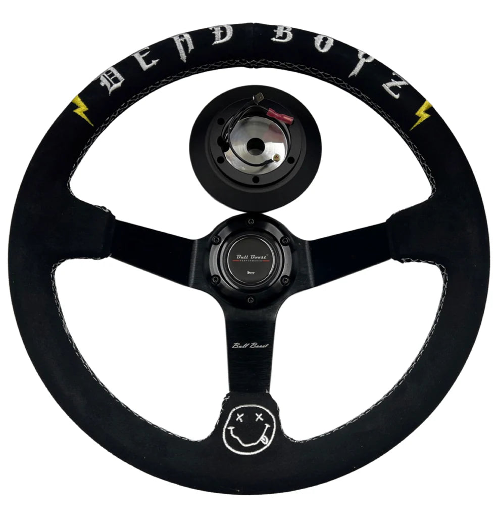 Black suede Dead Boyz car steering wheel with yellow lightning bolts and stitched smiley face