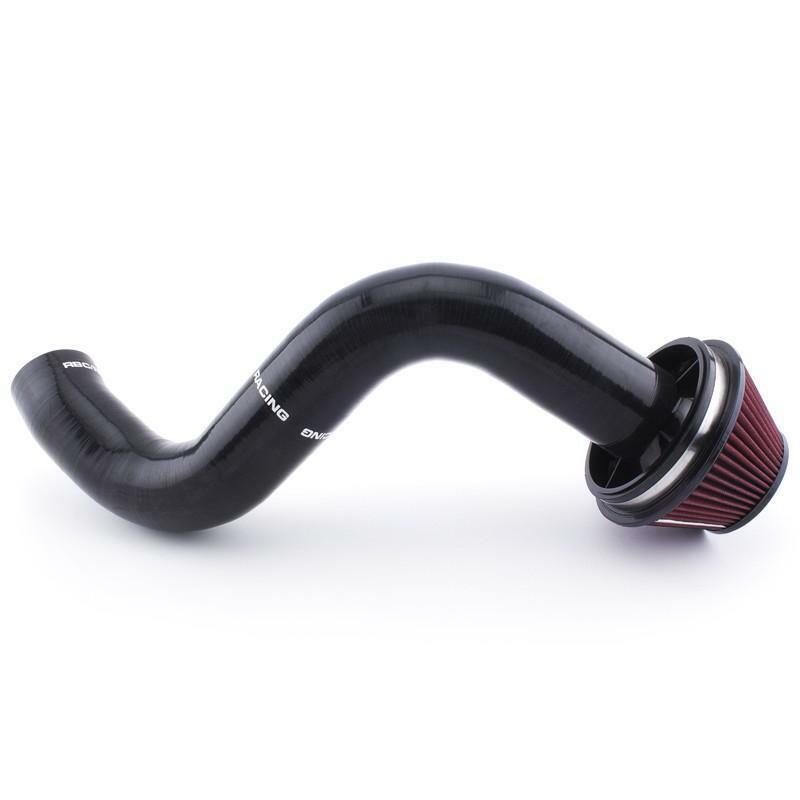 Black silicone intake pipe with red air filter for car engine on white background