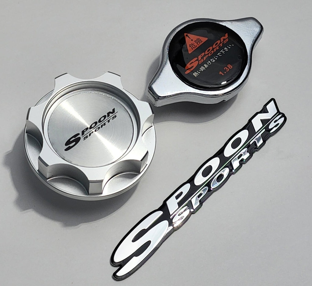 Spoon Sports oil cap, radiator cap, and logo sticker on a white background automotive parts