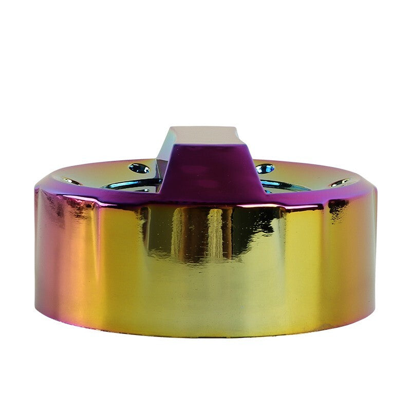 Rainbow titanium wheel center cap with metallic finish on white background