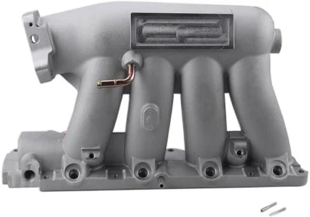 Aluminum car intake manifold with visible ports and fittings for automotive performance